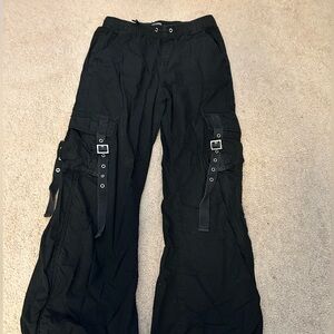 Black corgo pants with buckles on front